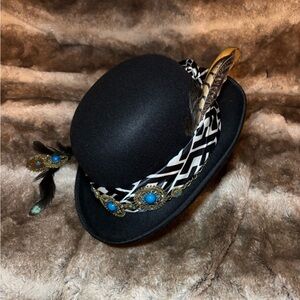 Elegant Black Feathered Hat with Blue Accents